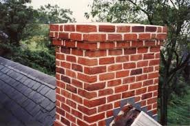Rebuilt red brick chimney on roof
