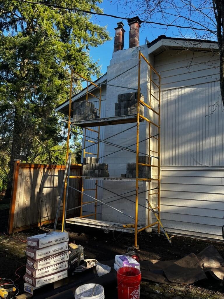 Chimney rebuild project with masonry scaffolding