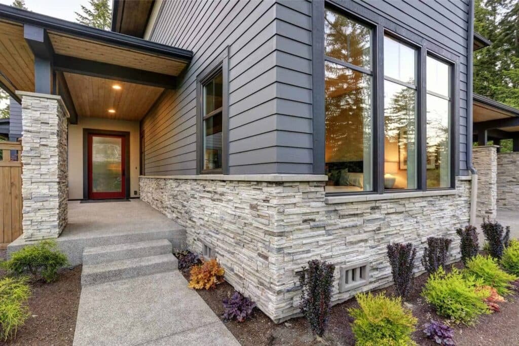 Modern home exterior with stone veneer siding
