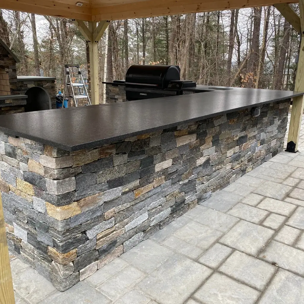Outdoor stone kitchen bar with countertop